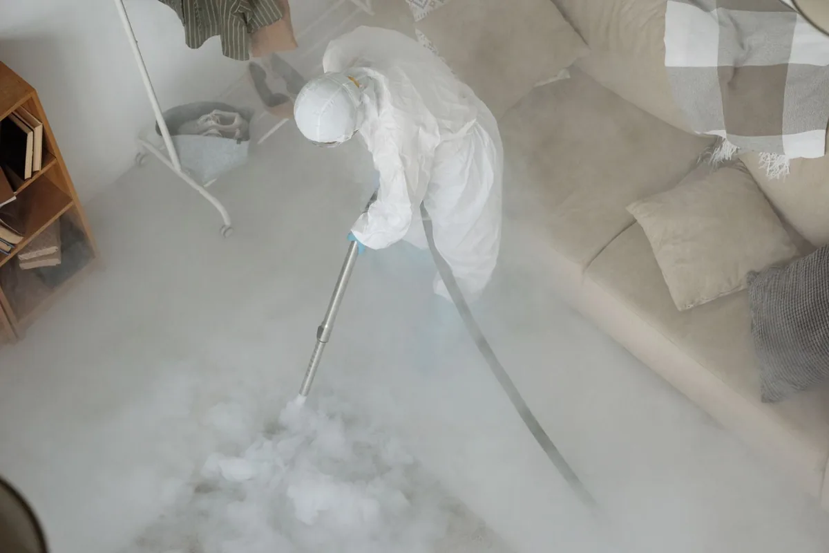 Biohazard cleanup technician in protective equipment, Delta, UT